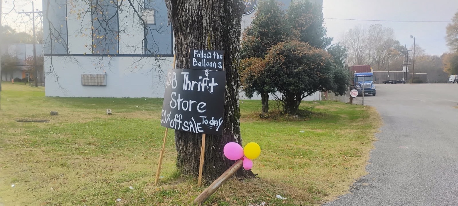 Tree with balloons and J&B sign