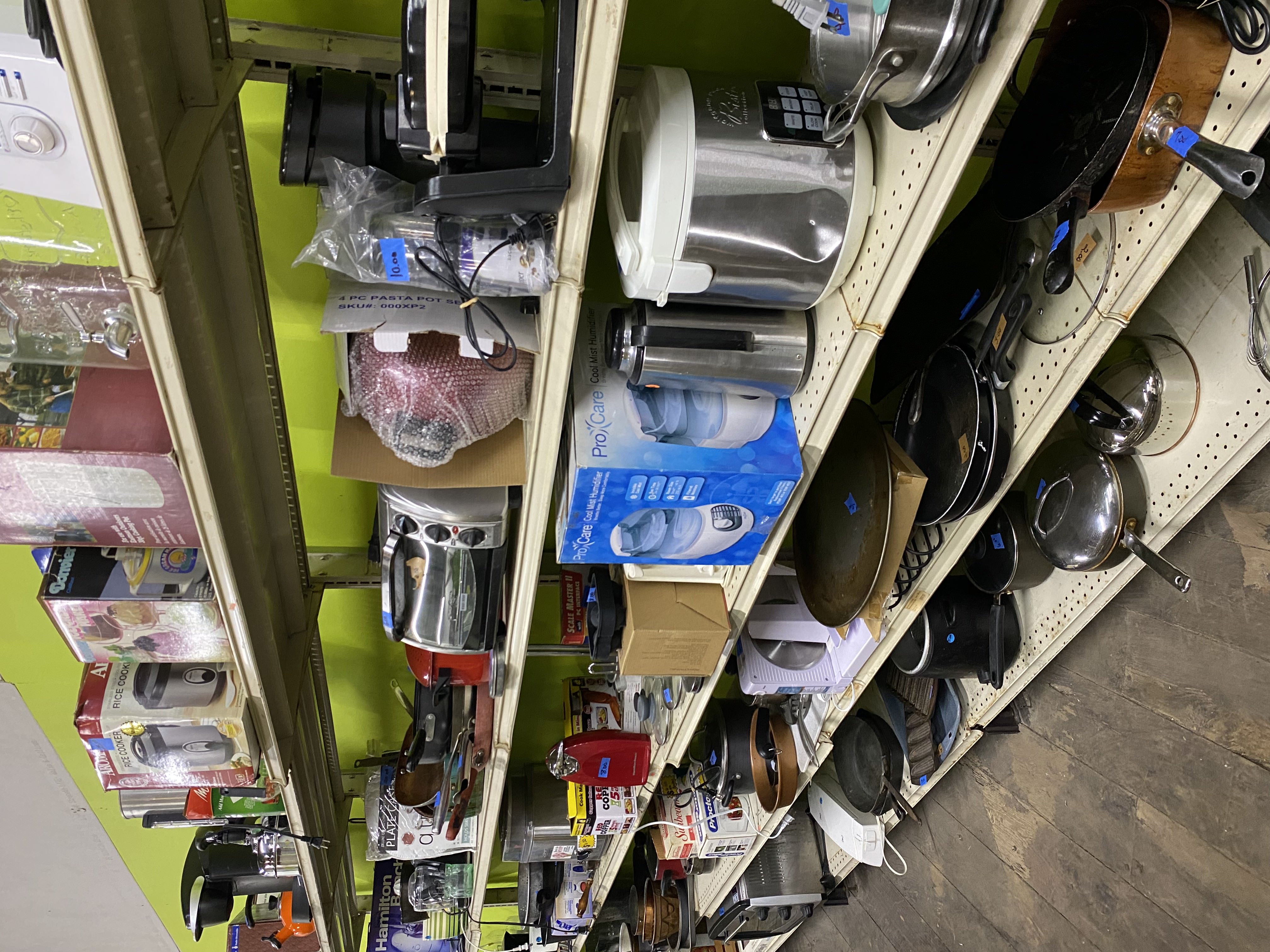 Assorted appliances displayed neatly on shelves