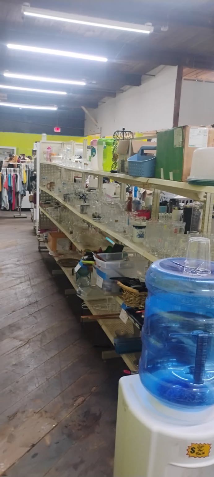 Tables, glassware, and household items display